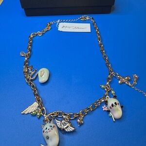 Betsey Johnson Gold Charm Necklace with Cat and Wing Pendants